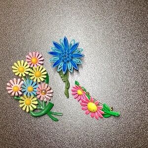 Vintage 3 Flower Pins. Color is bright. Metal. Some chipping